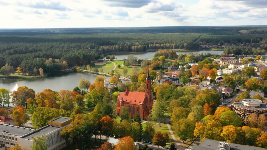 Druskininkai in autumn colours, drone picture of multi coloured trees in most beautiful city of Druskininkai in Lithuania Royalty-Free Stock Footage #1110018993