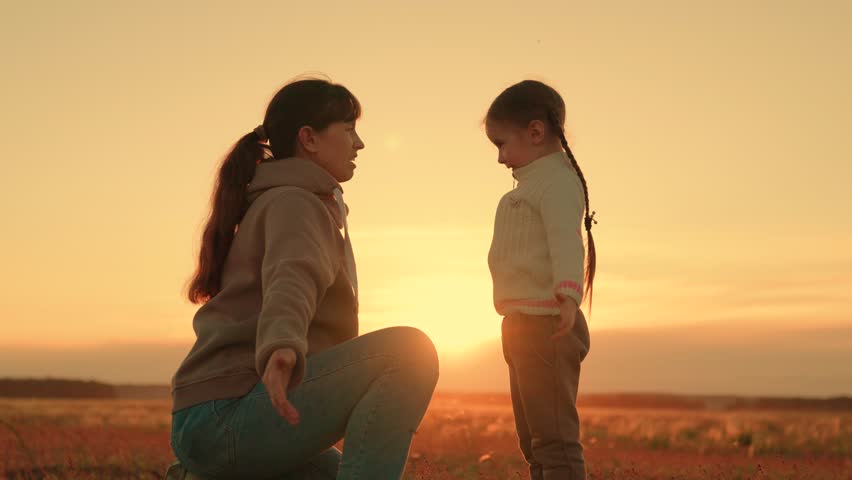 Child playing with mom happy hugs. Family in park in summer. Little child playing with parent. Happy family hugging in front of sun. Carefree childhood, joyful hugs of baby and mother in park, sunset Royalty-Free Stock Footage #1110020263