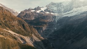 aerial drone footage of Berghaus Baregg with the glacier in the background switzerland