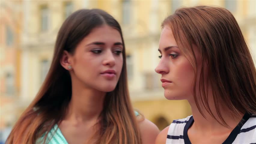 Girls whispering on a bench - Powered by Shutterstock - Get 15% off with code: PIKWIZARD15