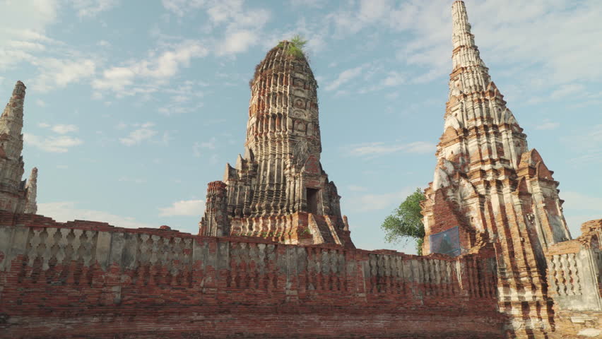 Awesome towers of Wat Chaiwatthanaram in Ayutthaya, Thailand. Scenic view of the Buddhist temple in the ancient city of the Ayutthaya Kingdom (Siam). Thailand is a popular tourist destination of Asia.