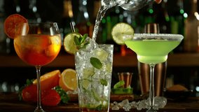 Super Slow Motion Shot of Pouring Long Drink Into Glass with Camera Motion at 1000fps. - Powered by Shutterstock - Get 15% off with code: PIKWIZARD15