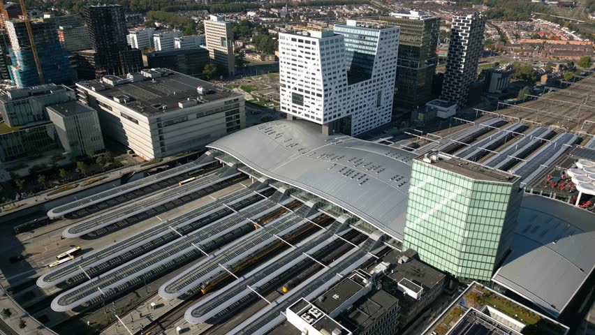 Aerial shot of Utrecht Central railway station the biggest train station in the Netherlands, drone shot of central station moving backwards and up
