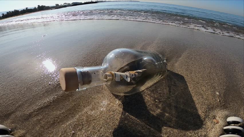 Message in a bottle on the summer island beach