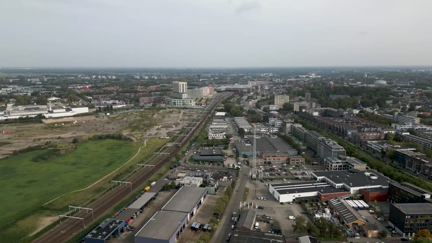 Aerial shot of Breda train station with incoming train | Shutterstock HD Video #1110045171