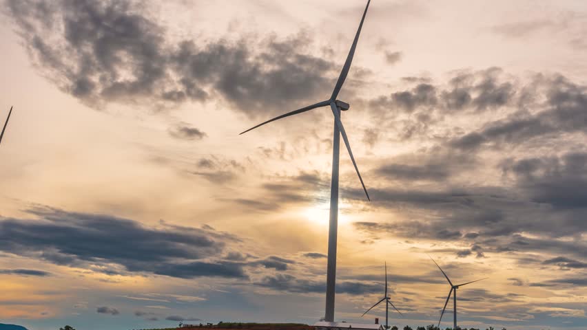 Time lapse of scenery on hillside with wind turbines in the morning. This is a clean energy source that does not pollute the environment to serve electricity for people | Shutterstock HD Video #1110045893