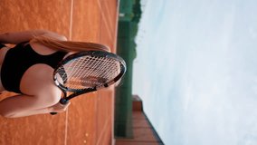 vertical video back view girls before playing tennis on court with racket in hands hobby game training championship sport