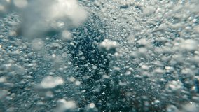 Air bubbles and sun glare on evening time on surface of water at sunset, underwater view - Powered by Shutterstock - Get 15% off with code: PIKWIZARD15