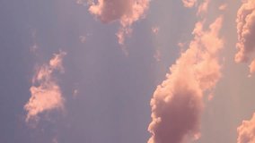 Vertical. Gentle Colorful Sunrise Sky with Peach Pink Puffy Clouds in Sunlight. Beautiful Blue Lilac Sky with Colored Clouds at Dawn. Airplane Window, Aerial Shot, Time Lapse of Clouds. Background 4K. - Powered by Shutterstock - Get 15% off with code: PIKWIZARD15