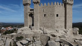 Panoramic aerial drone exterior view at the iconic Penedono Castle and main entrance gate, on Penedono village downtown, Viseu, Portugal