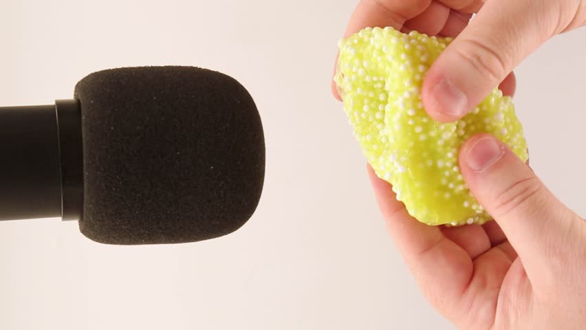 The mucus is yellow with white foam balls next to the microphone. ASMR Relaxation Videos, Part 1 Royalty-Free Stock Footage #1110072731