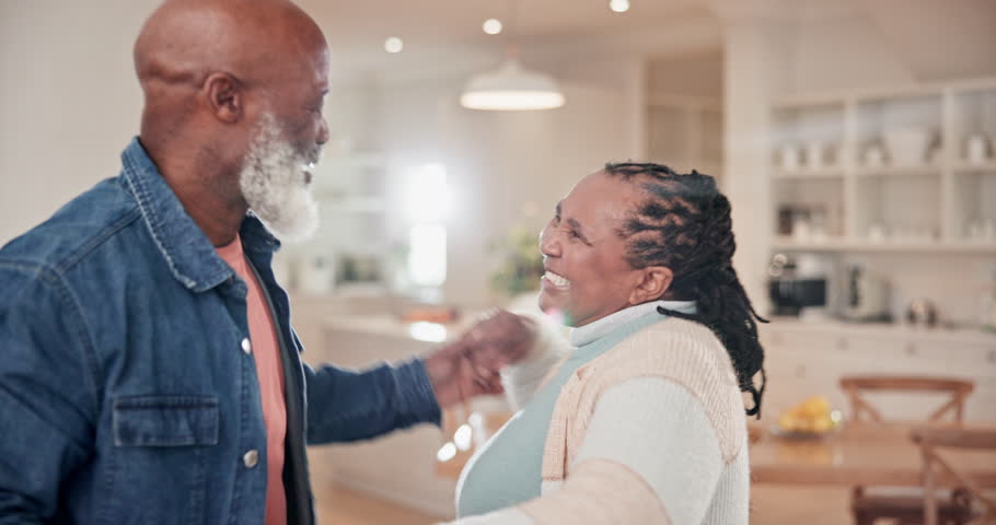 Senior, black couple and dancing in living room with happiness, energy or music at house or home. Elderly, man and woman with dance, steps and movement for retirement or bonding for freedom and peace Royalty-Free Stock Footage #1110072897