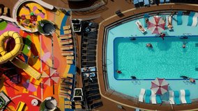 Aerial view of the cruise ship in open water. Cruise liner sailing the ocean or sea on a sunny summer day. Aerial top view of luxury large cruise ship sailing full speed on open water, luxury vacation - Powered by Shutterstock - Get 15% off with code: PIKWIZARD15