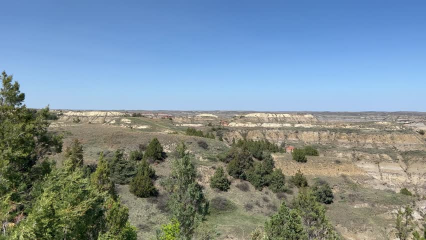 Panning left on  the  badlands hills and mountains in Theodore Roosevelt National Park in North Dakota.