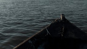 Bow of an Old Wooden Boat on River at Sunset. Close Up. - Powered by Shutterstock - Get 15% off with code: PIKWIZARD15