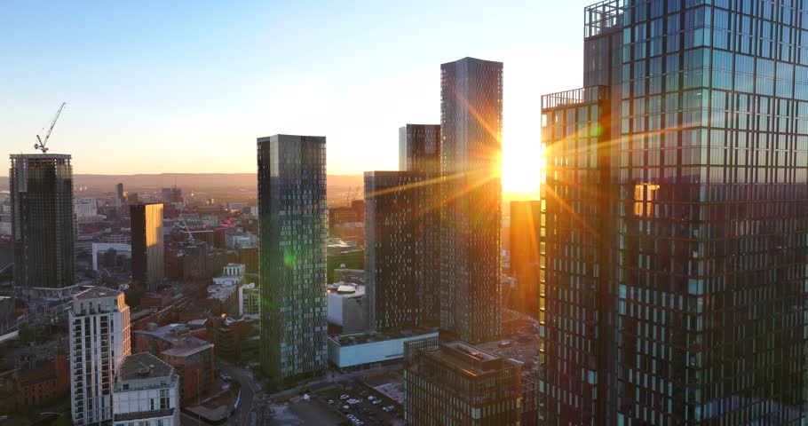 Aerial footage of a Beautiful sunrise between Deansgate towers in Manchester UK.  Royalty-Free Stock Footage #1110089323