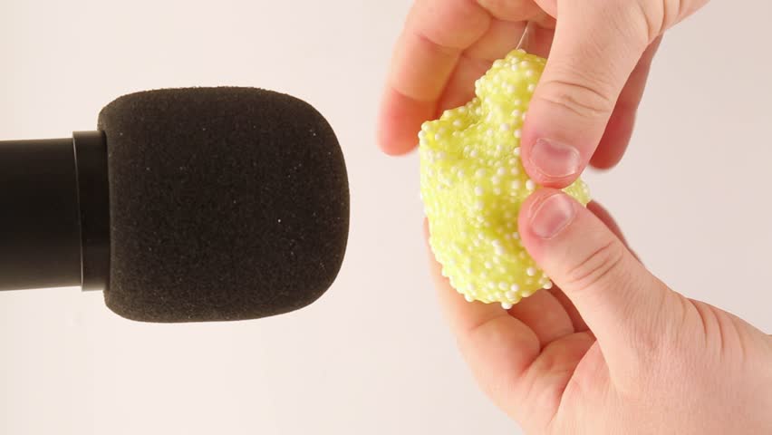 The mucus is yellow with white foam balls next to the microphone. ASMR Relaxation Videos, Part 2 Royalty-Free Stock Footage #1110090853