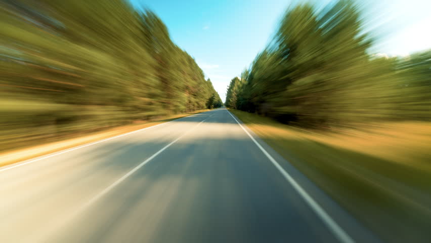 Bright Motion Timelapse of a Speedy Day Drive Trees Turning Into Abstract Blur. Hyperlapse Road Trip Travel Concept Sort of Dashcam POV. Windshield View Royalty-Free Stock Footage #1110098893