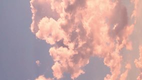Vertical Footage. Colorful Fluffy Clouds In Blue Color Sky At Sunset In Sunlight Beautiful View, Timelapse. Gentle Sunset Sky in Sunlight and Time Lapse of Pink Orange Clouds, Beauty, Relax, Vertical.