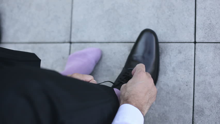 Businessman lace up black shoes | Shutterstock HD Video #11101043