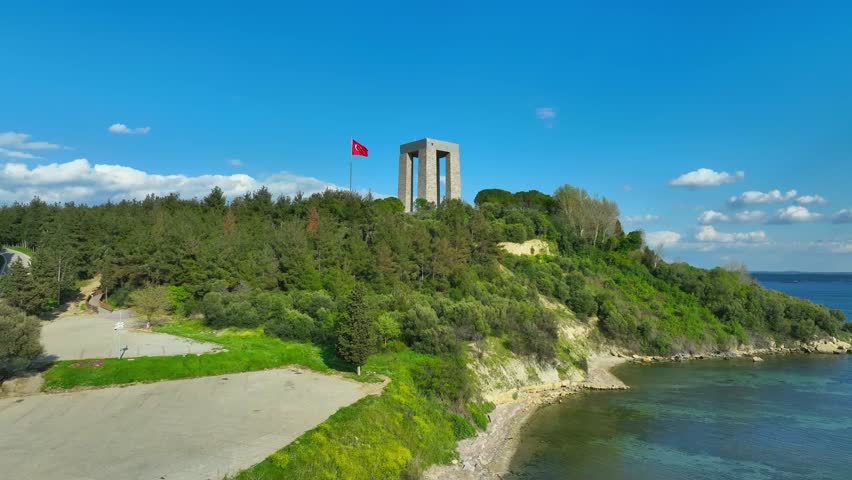Martyrs Monument Canakkale. Turkish flag. Red Turkish flag waving on the sea. Drone Shoot