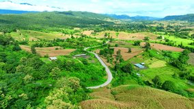 Drone imagery unveils agriculture on elevated terrain, showcasing efficient land use and sustainable practices on hills and plateaus. Agriculture concept. Thailand.
