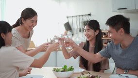 Happy Asian man and women enjoy having a launch together with a bowl of salad and steak, footage showing group of Asian people have a meal together and drink water. - Powered by Shutterstock - Get 15% off with code: PIKWIZARD15