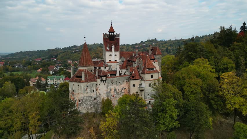 Aerial drone shot of Bran Castle in autumn. Medieval Bran Castle in Transylvania, Romania. The mystic Count Dracula's Castle is located in Bran, near the town of Brasov.  Royalty-Free Stock Footage #1110118225