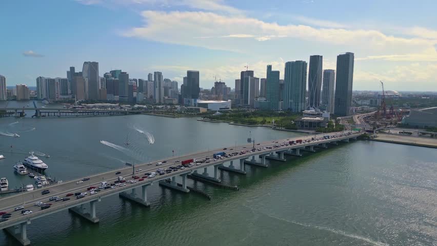 Flyover traffic on MacArthur Causeway ICW Bridge with view towards Miami downtown skyline, sunny weather Royalty-Free Stock Footage #1110118573
