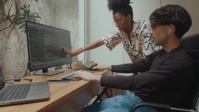 Young African-American woman and Hispanic man discussing program code on computer screen, working on IT project in comfortable home office. Zoom-out shot - Powered by Shutterstock - Get 15% off with code: PIKWIZARD15