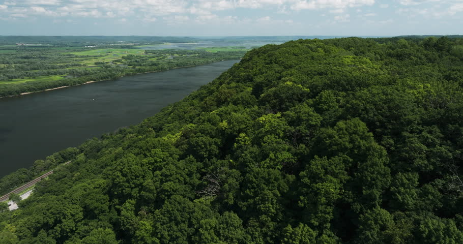 Natural splendor of Minnesota, Great River Bluffs State Park, verdant forest overlooking Mississippi River - aerial