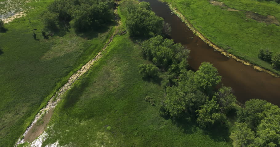 Aerial View of Mississippi River Surrounded By Lush Greenery In Wisconsin, USA. tilt-up