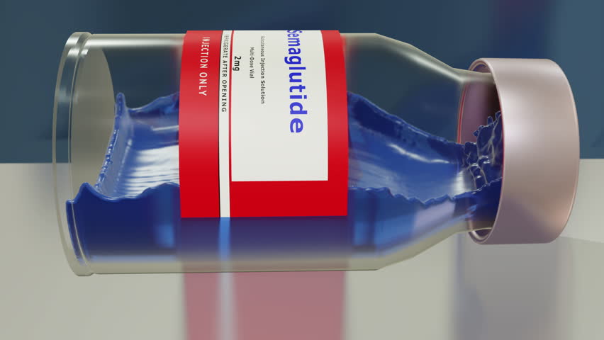 This animation shows a closeup view of a rolling vial of Stemaglutide medication, a syringe and cotton balls. Royalty-Free Stock Footage #1110129813