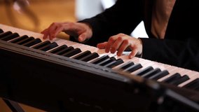 Pianist musician. 4K close up video with hand male playing at an upright piano. Beautiful jazz concert piano music video.