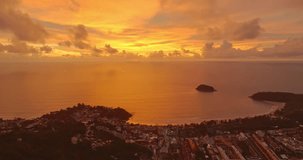 

Majestic sunset or sunrise landscape Amazing light of nature amazing cloud scape sky and colorful clouds moving away rolling. 
colorful yellow sunset clouds above the islands. 4K video cloudscape. 