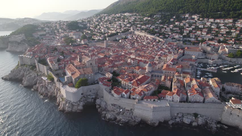 Drone view of historic Dubrovnik Old Town and its fortified stone walls, Croatia