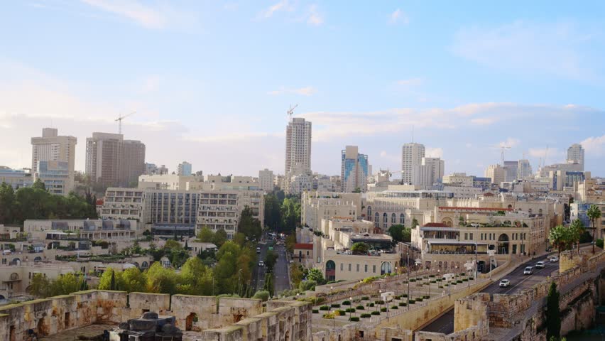 Wide view of Mamilla neighborhood in Jerusalem close to the Jaffa Gate. Old buildings and structures of exterior walls next to new and modern houses and malls and hotels close to Old City of Jerusalem
