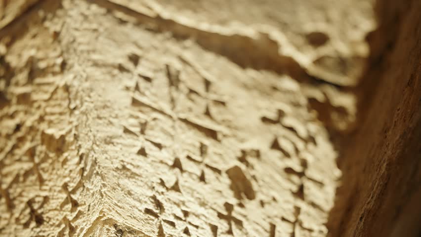 Crosses engraved on stone by Crusaders in the Church of the Holy Sepulchre. Graffiti from ancient times in Old City of Jerusalem in Israel carved by crusaders visiting the holy site for Christians