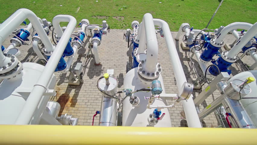 High tech machines and pumps and valves at a natural gas pumping station Royalty-Free Stock Footage #1110147973