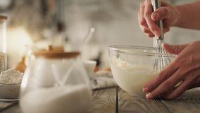 Baking. A young mother in comfortable clothes is making homemade cookies at home. A woman who follows proper nutrition prepares cookies at home without gluten and sugar. - Powered by Shutterstock - Get 15% off with code: PIKWIZARD15