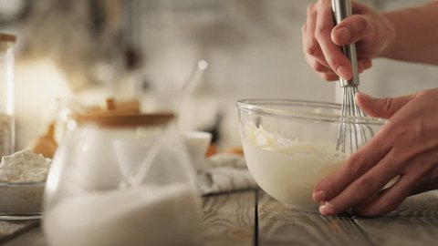 Baking. A young mother in comfortable clothes is making homemade cookies at home. A woman who follows proper nutrition prepares cookies at home without gluten and sugar. : vidéo de stock