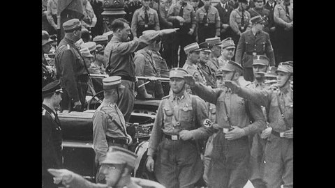 Germany - 01 01 1938 , Nazi party membres march past Hitler, Hitler gives speech, crowds salute Adlı Haber Amaçlı Stok Video