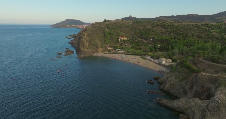 Aerial view of a beach with people near Collioure at the Mediterranean Sea during a hot summer day. Royalty-Free Stock Footage #1110150935