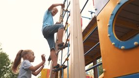 girl and boy walking in the park. happy family walking in the park. brother and sister climbing the stairs. joyful children walking in the park. children having fun in the lifestyle park - Powered by Shutterstock - Get 15% off with code: PIKWIZARD15