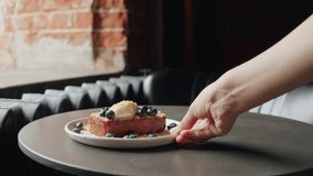 Delicious brioche dessert with cheese cream and blueberries in cafe bar close-up. Piece of cake on the table. Pastry  - Powered by Shutterstock - Get 15% off with code: PIKWIZARD15