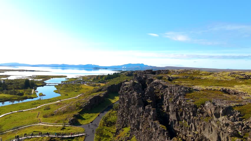 Aerial view of Thingvellir National Park, above the tectonic plates. Blue skies and greenery, Lake Bingvallavatn in the background