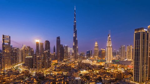 Day to night, zoom in timelapse of Burj Khalifa and other skyscrapers in Downtown Dubai, United Arab Emirates (UAE), business and finance concept, modern cities and skylines. Stockvideo