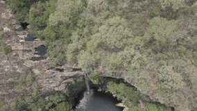 Drone footage of the scenic waterfall Chorro San Luis embedded in a thick, tropical forest near Roboré in the lowlands of Bolivia - Traveling and exploring South America - raw version