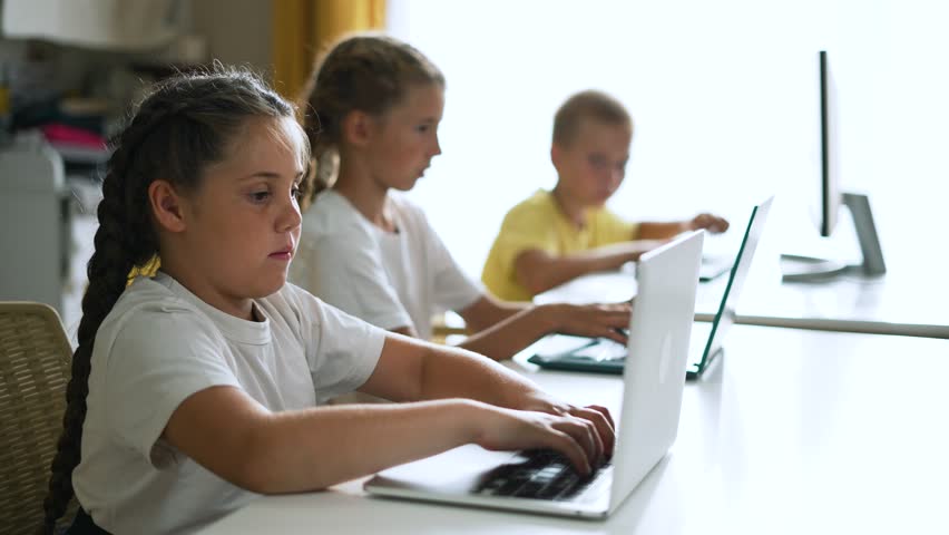 Happy team of friend.Children education at school with laptop.Children play together at computer as team.Online games for teaching teamwork at school in classroom.Online work learning laptop at school Royalty-Free Stock Footage #1110169387
