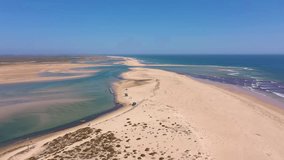 Aerial video filming by drone of the marine reserve Ria Formosa Faro Portugal Algarve. Praia de Barinha. Flight moving forward on the duct.